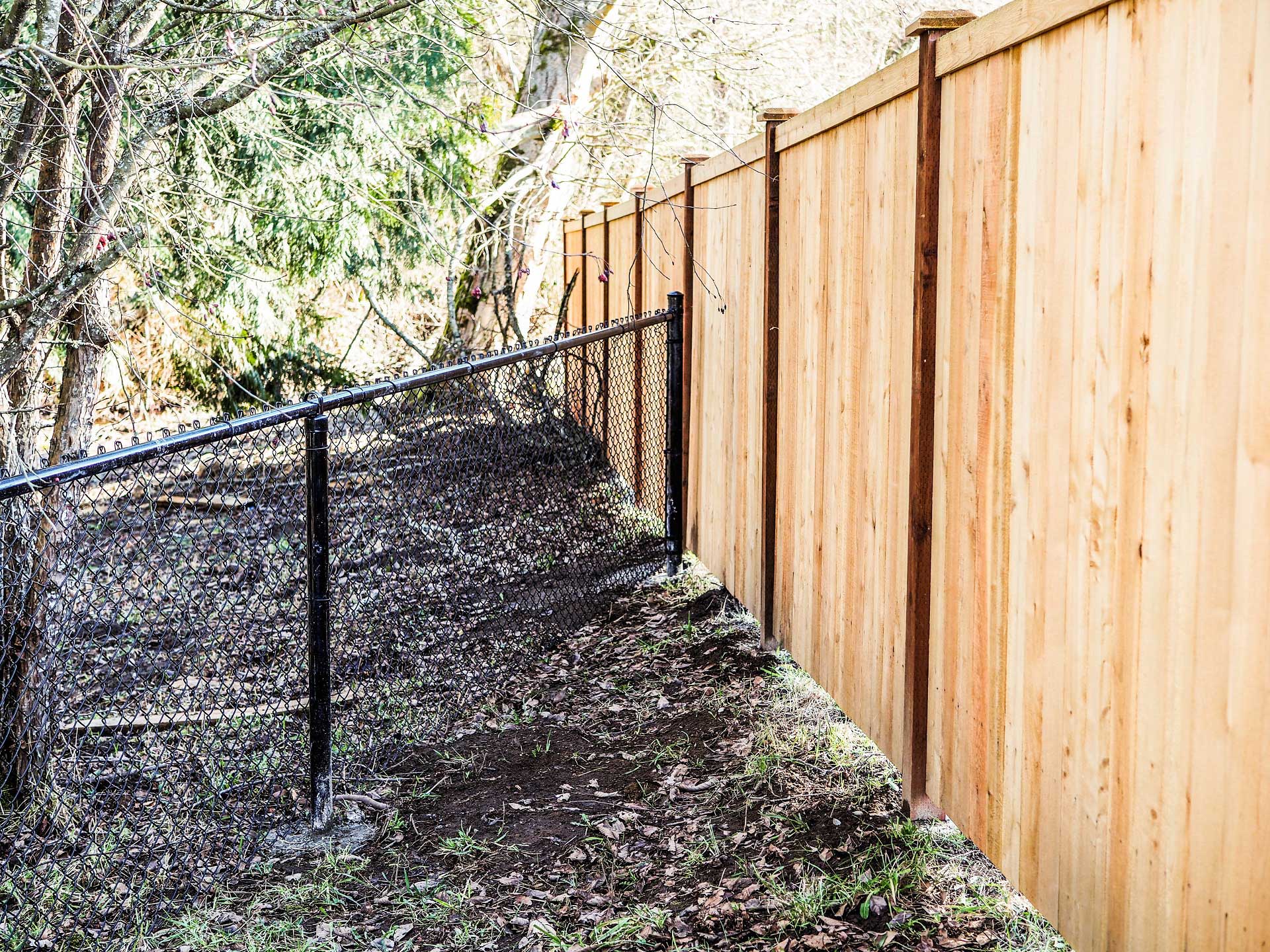 Wood Fence In Front Of Chain Link WoodsInfo