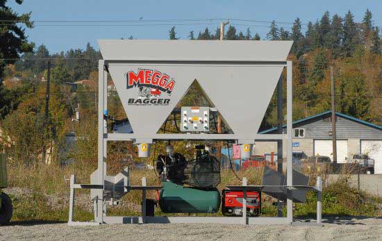 Double Funnel Megga Bagger sandbag filling machine set up outdoors.